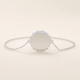14k solid white gold sun bracelet with a polished circular sun-inspired medallion and fine chain design.
