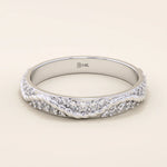 14k solid white gold twisted eternity wedding band, featuring intertwined strands adorned with round brilliant-cut moissanites in a continuous setting
