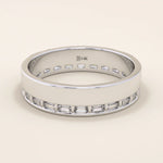 14k solid white gold wide wedding band featuring channel-set baguette moissanite stones in an eternity setting

