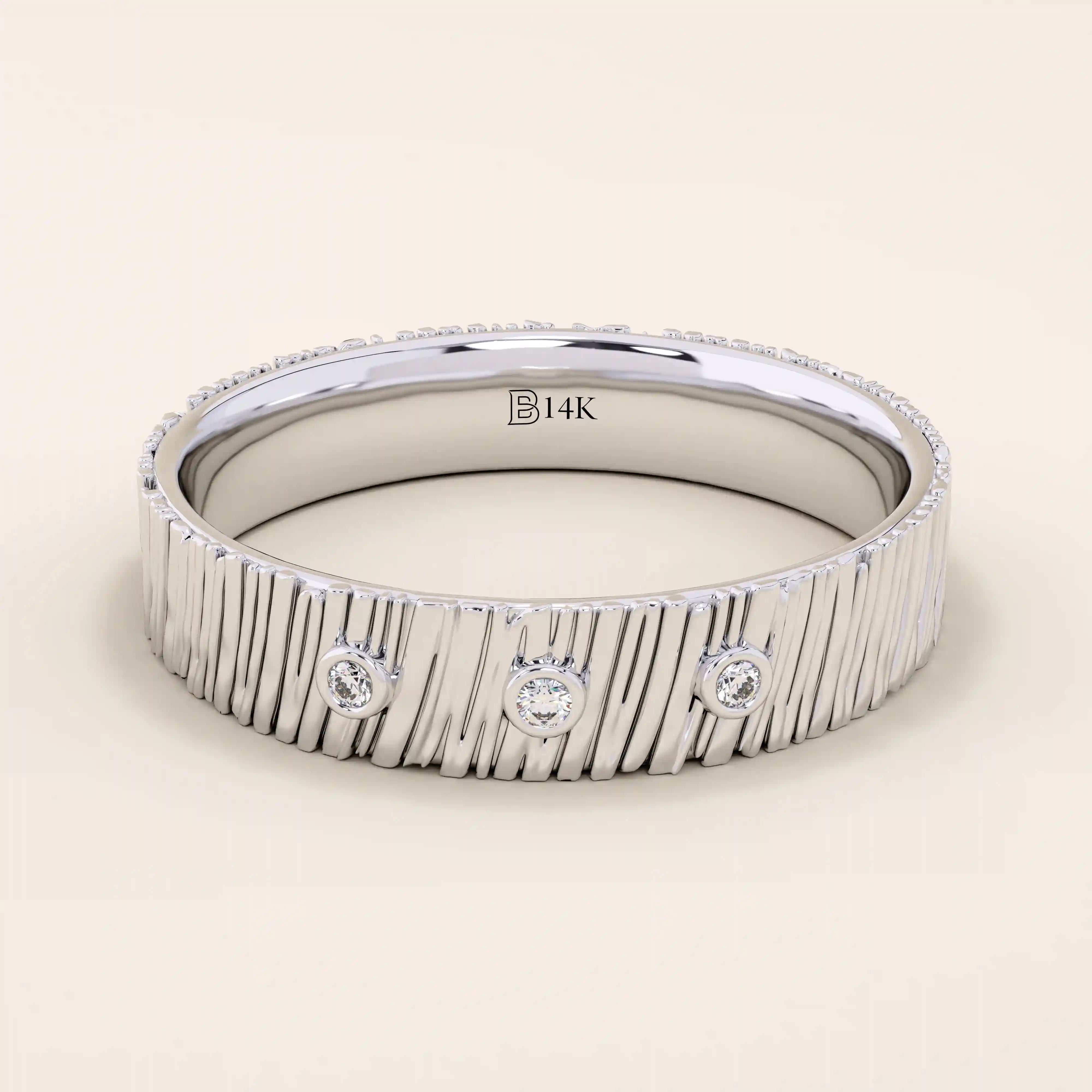 14k solid white gold wide wedding band with a wood grain texture and three bezel set round brilliant cut moissanite stones, distinctive and modern statement ring
