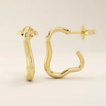 14k solid yellow gold abstract-shaped hoop stud earrings with a smooth, high-polish finish and fluid, sculptural curves.
