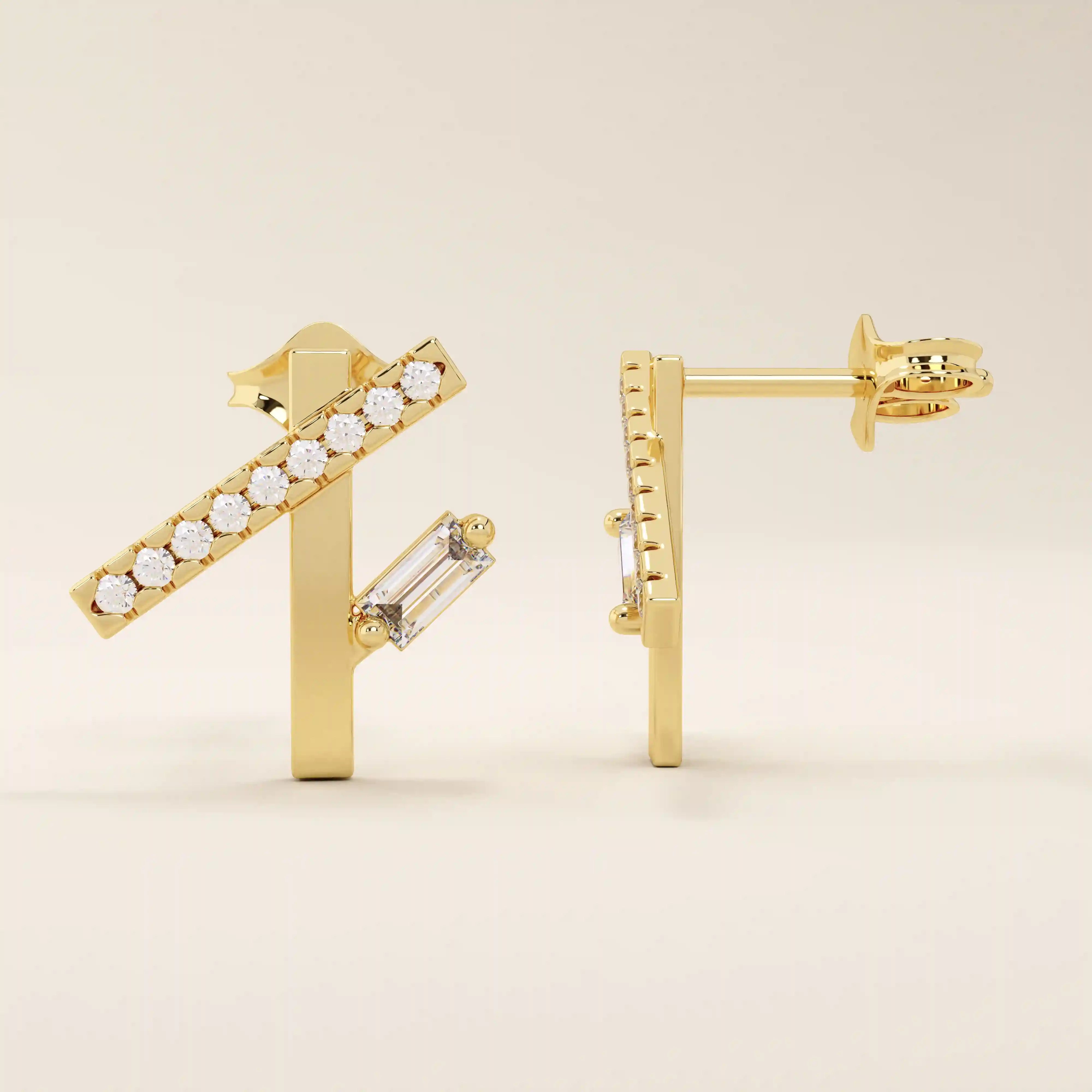 14k solid yellow gold asymmetrical line stud earrings with a horizontal row of round-cut moissanite and a single vertical baguette-cut moissanite accent.
