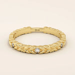 14k solid yellow gold band featuring a laurel leaf design with bezel set round brilliant cut moissanite stones, elegant fine jewelry for weddings or stacking
