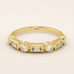 14k solid yellow gold band featuring alternating baguette cut and round brilliant cut moissanite stones in a modern bezel setting, elegant fine jewelry for weddings or stacking
