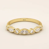 14k solid yellow gold band featuring alternating marquise cut and round brilliant cut moissanite stones in a smooth bezel setting, elegant fine jewelry for weddings or special occasions
