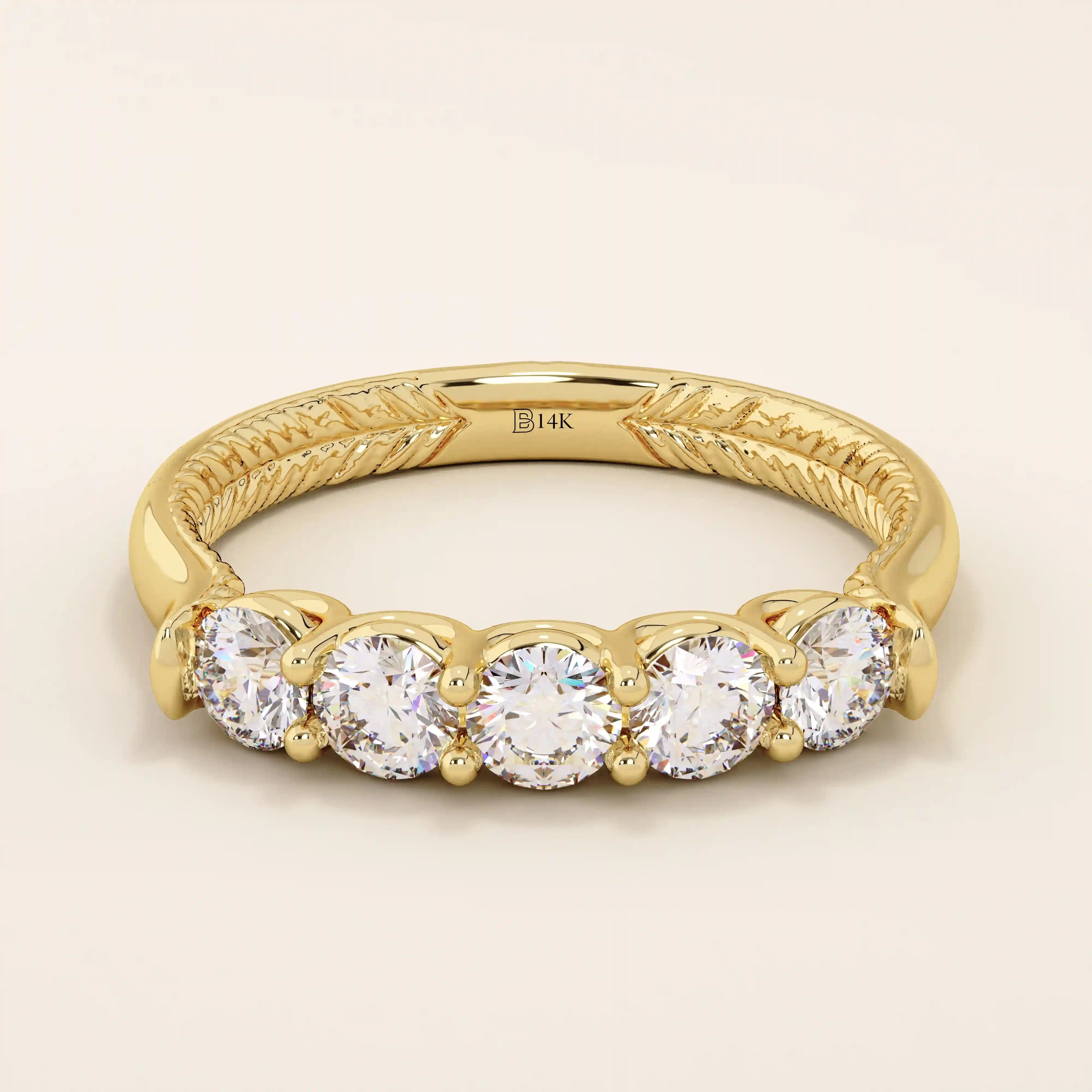 14k solid yellow gold band featuring five round brilliant cut moissanite stones in a classic prong setting with engraved detailing along the shank, timeless fine jewelry for weddings or anniversaries
