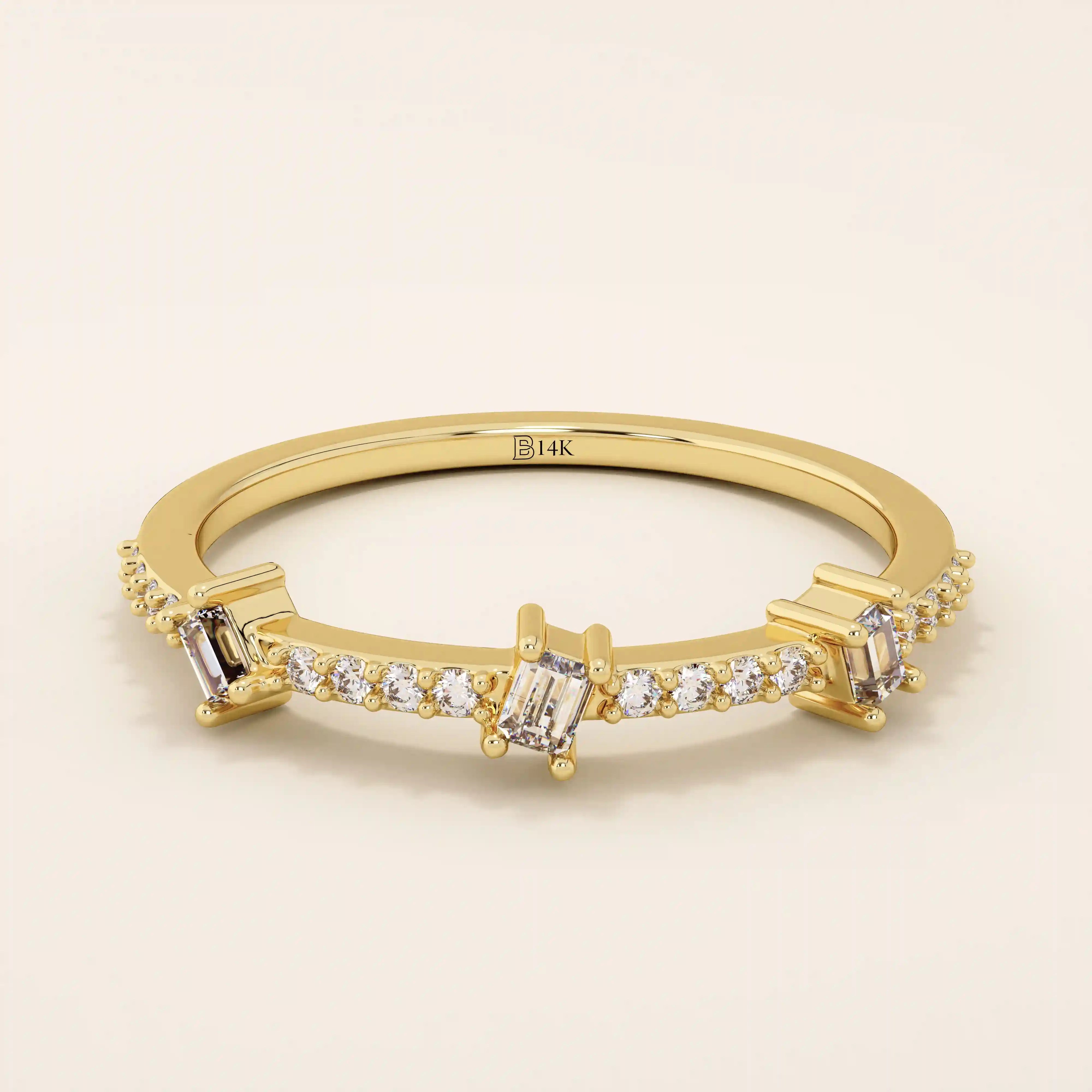 14k solid yellow gold band featuring three baguette cut moissanite stones spaced along a row of pavé set round moissanite accents, modern fine jewelry for weddings or stacking
