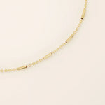 14k solid yellow gold bar chain bracelet featuring sleek horizontal bar links evenly spaced along a delicate gold chain, offering a modern and minimal aesthetic.
