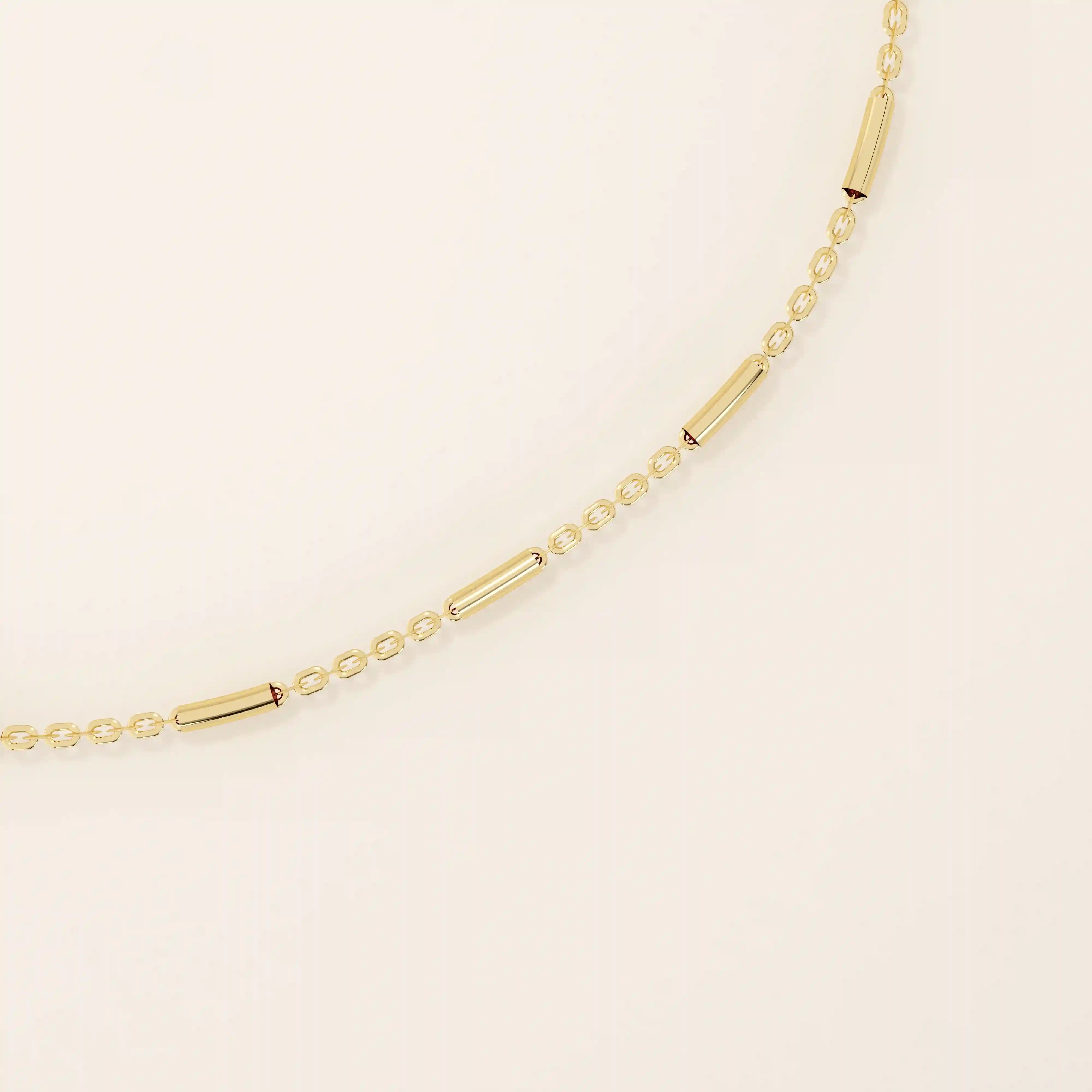 14k solid yellow gold bar chain bracelet featuring sleek horizontal bar links evenly spaced along a delicate gold chain, offering a modern and minimal aesthetic.
