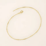 14k solid yellow gold bar chain bracelet featuring sleek horizontal bar links evenly spaced along a delicate gold chain, offering a modern and minimal aesthetic.
