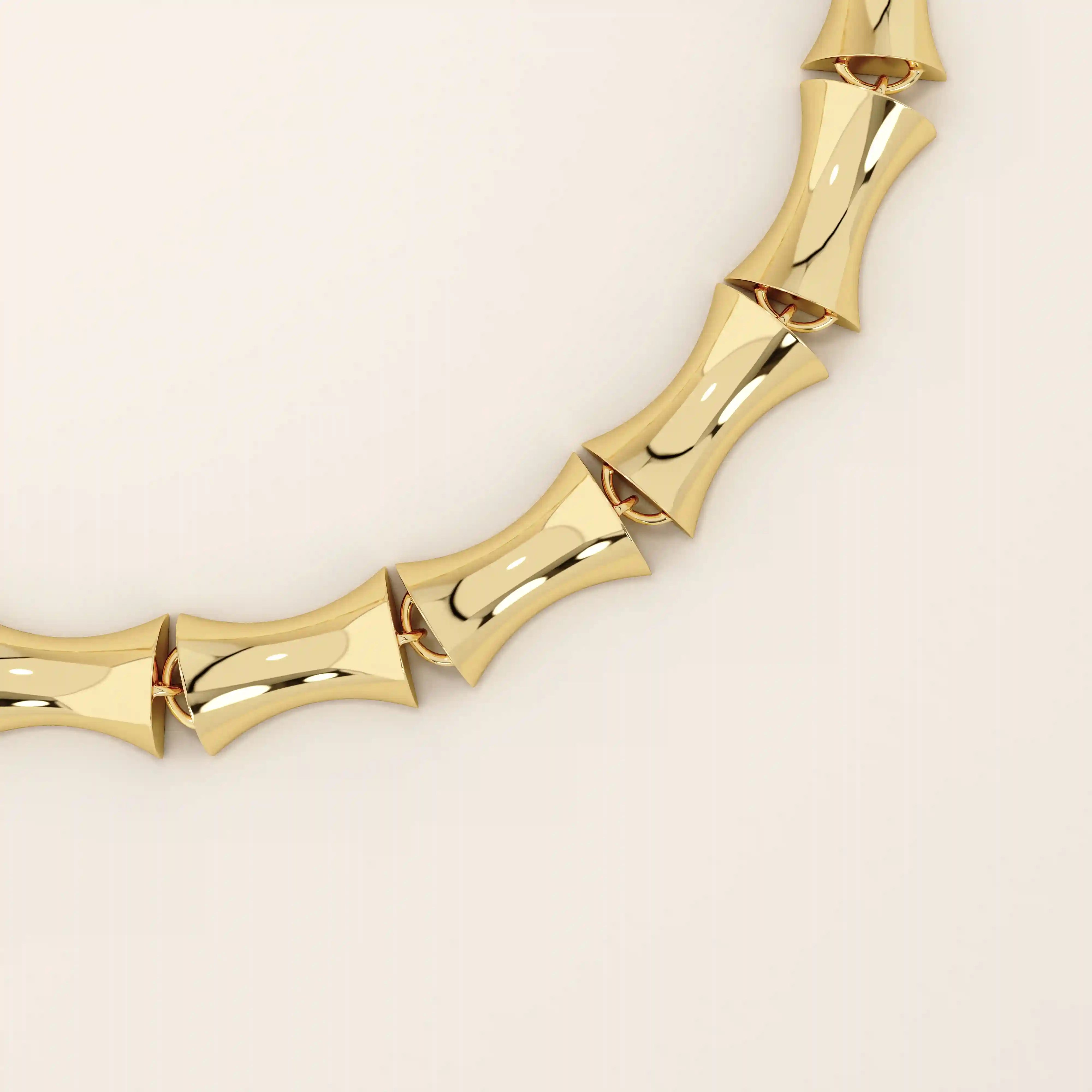 14k solid yellow gold bone bracelet featuring thick, bold links with a polished curved design.
