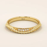 14k solid yellow gold braided wedding band with a row of round brilliant diamonds, delicate and elegant design for everyday wear or special occasions
