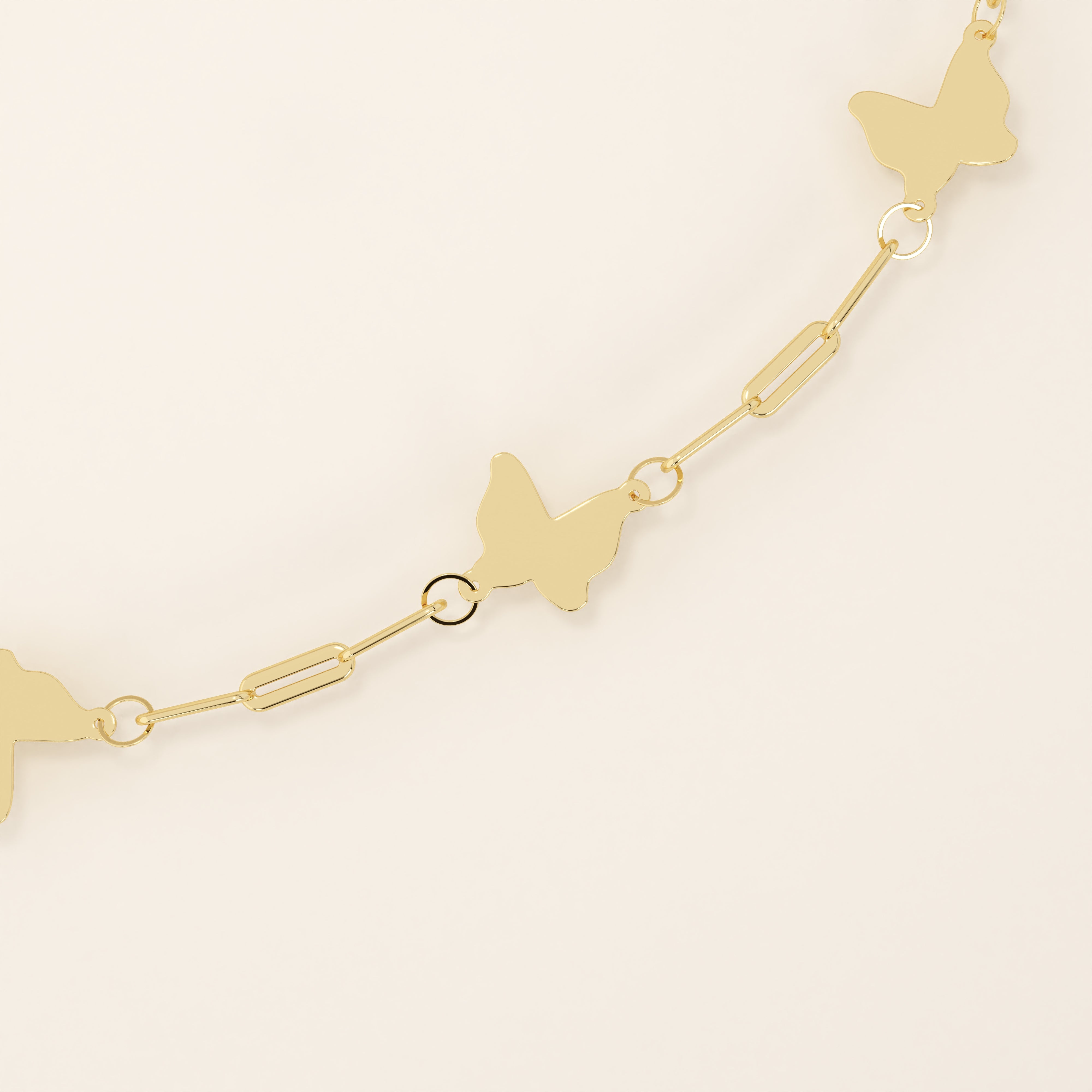 14k solid yellow gold butterfly chain bracelet featuring polished butterfly charms linked with delicate rectangular chain links.
