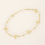 14k solid yellow gold butterfly chain bracelet featuring polished butterfly charms linked with delicate rectangular chain links.
