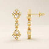14k solid yellow gold dangling arrow stud earrings featuring bezel-set round moissanites and pavé arrowhead details.
