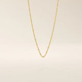 14k solid yellow gold dot chain necklace featuring small, evenly spaced flat square discs linked along a delicate chain, creating a sleek and modern everyday piece.
