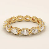 14k solid yellow gold eternity band featuring sideways pear cut moissanite stones surrounded by pavé set round moissanite accents and intricate milgrain detailing, luxurious fine jewelry for weddings or anniversaries

