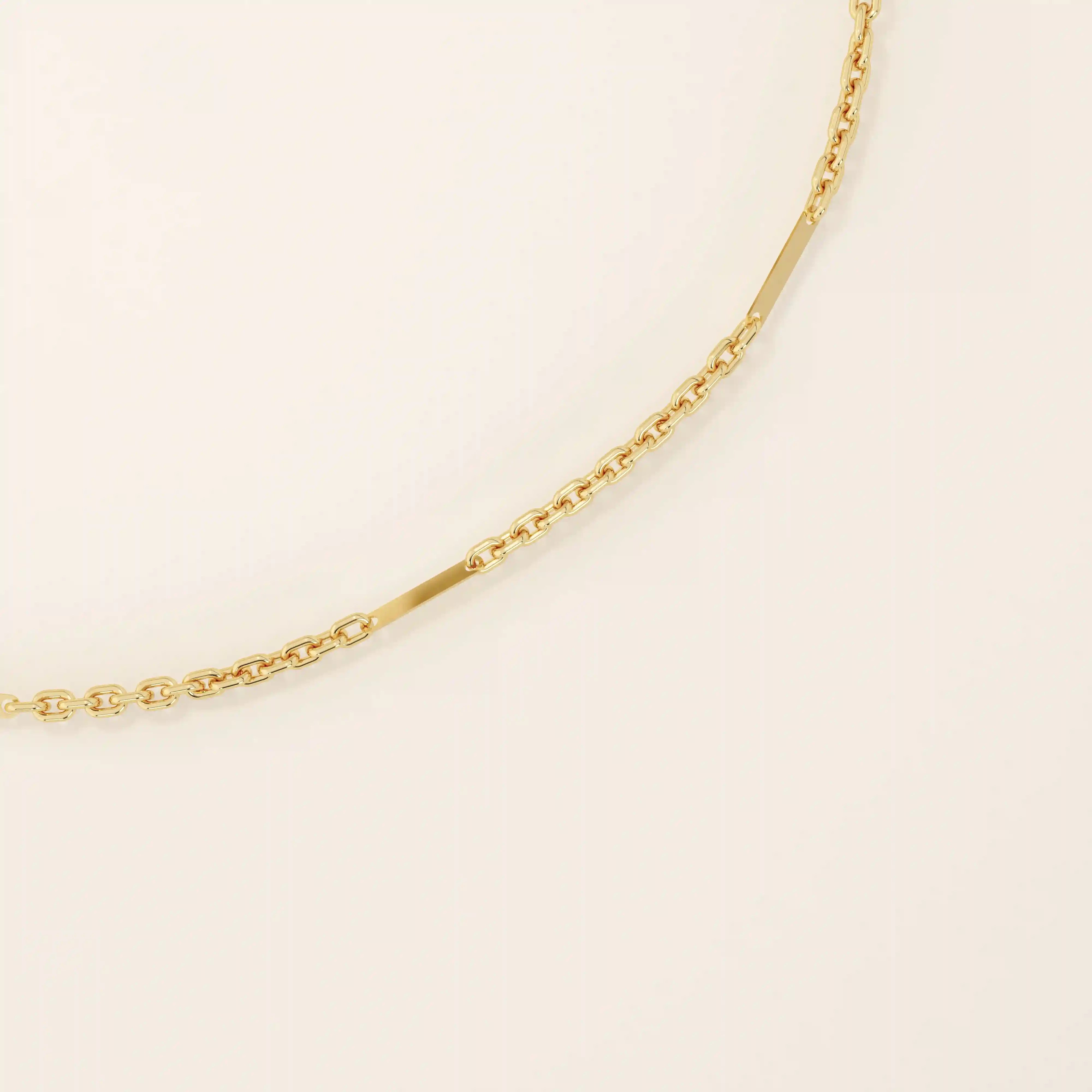 14k solid yellow gold flat bar chain bracelet featuring sleek rectangular links spaced along a delicate gold chain, offering a minimalist yet sophisticated style.
