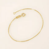 14k solid yellow gold flat bar chain bracelet featuring sleek rectangular links spaced along a delicate gold chain, offering a minimalist yet sophisticated style.
