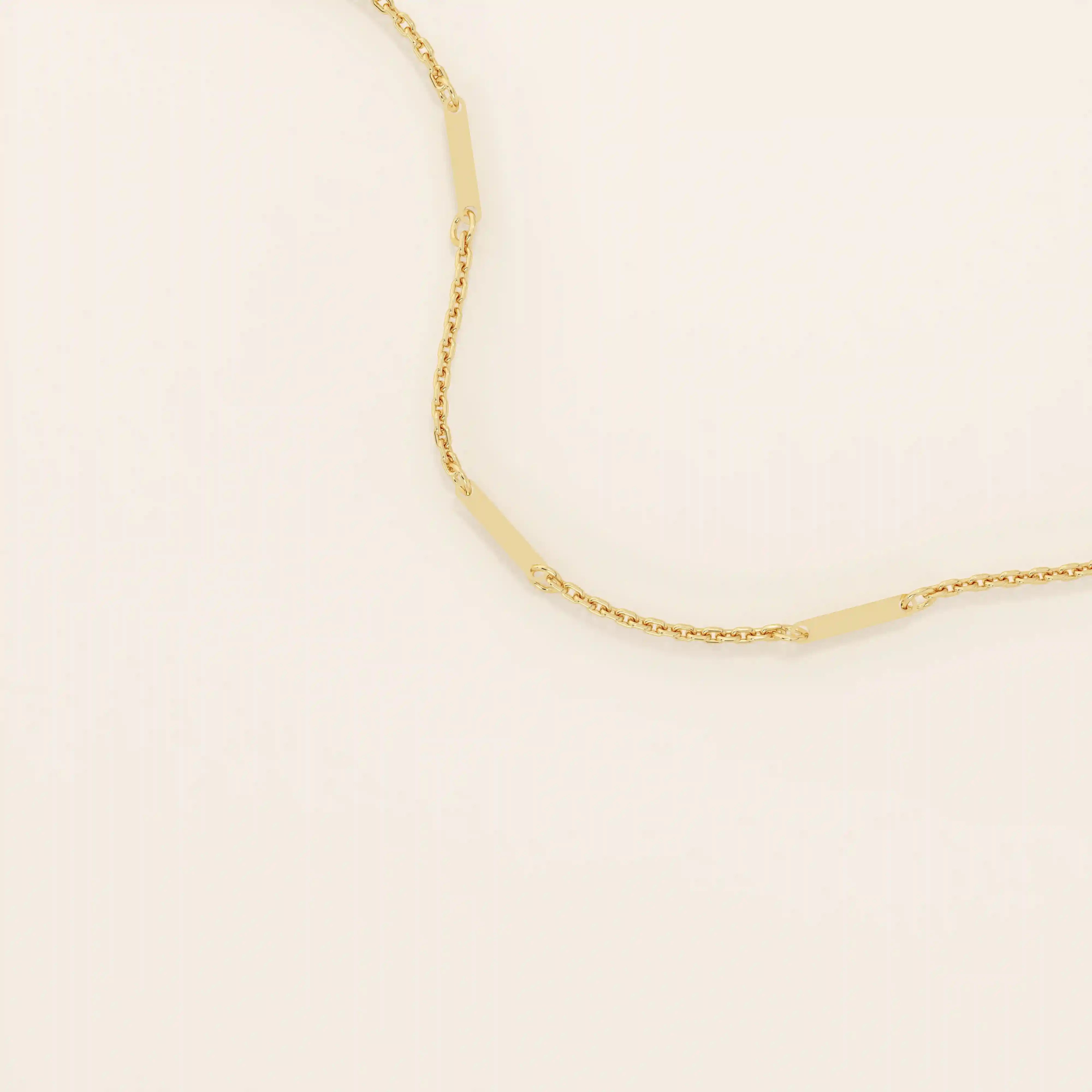 14k solid yellow gold flat bar chain necklace featuring slim, polished rectangular bar stations evenly spaced along a delicate cable chain, creating a sleek and modern accessory.
