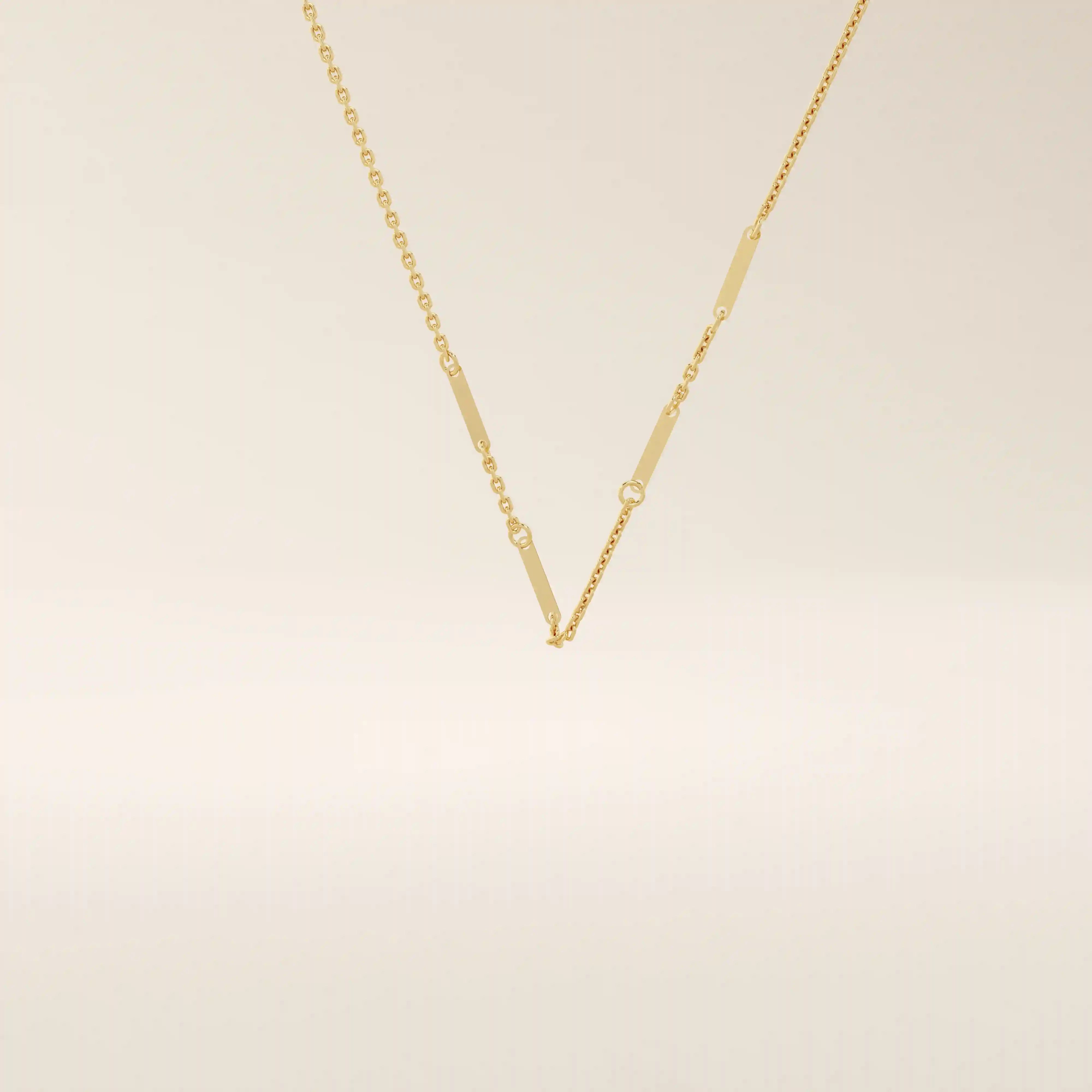 14k solid yellow gold flat bar chain necklace featuring slim, polished rectangular bar stations evenly spaced along a delicate cable chain, creating a sleek and modern accessory.
