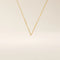 14k solid yellow gold flat bar chain necklace featuring slim, polished rectangular bar stations evenly spaced along a delicate cable chain, creating a sleek and modern accessory.
