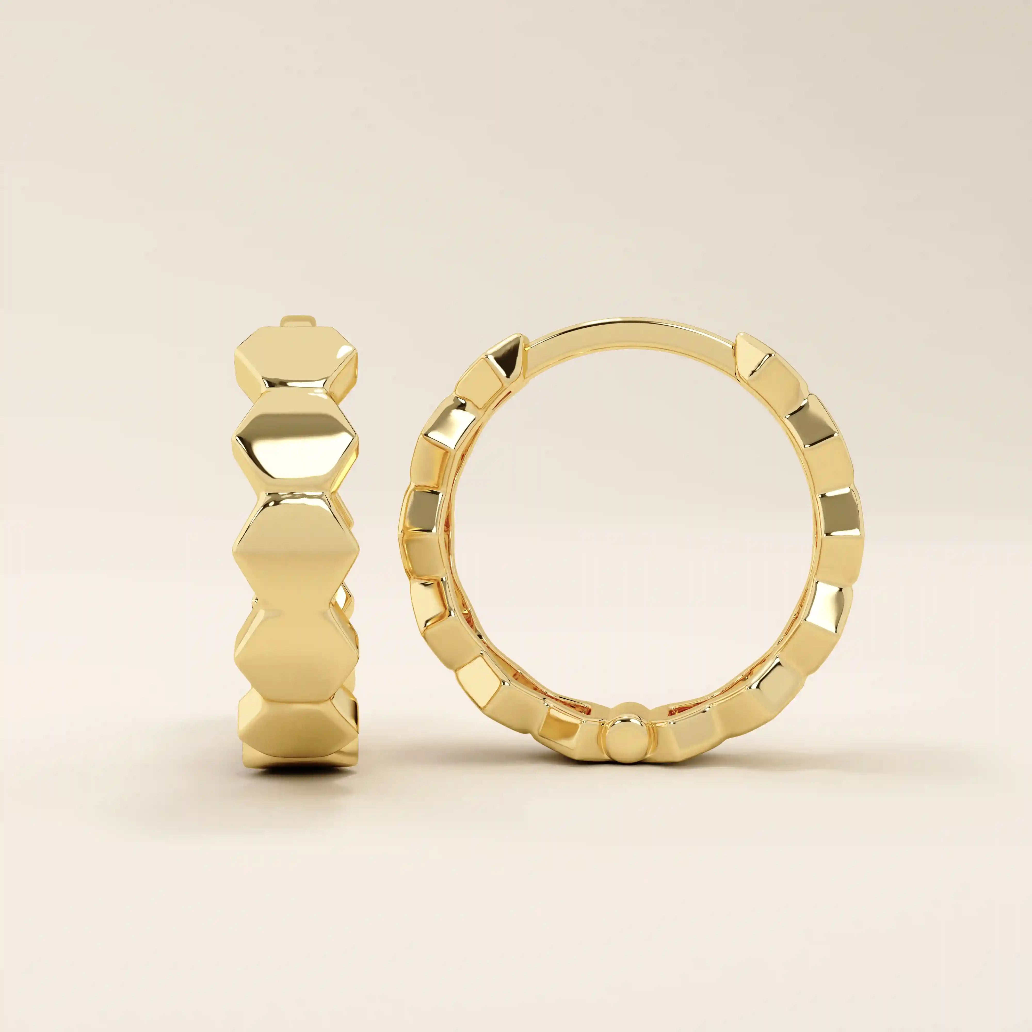 14k solid yellow gold hoop earrings with bold, interlocking hexagon links forming a continuous geometric design, polished to a mirror-like shine.
