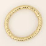 14k solid yellow gold rope bangle bracelet featuring a twisted rope texture, polished finish, and rounded edges.
