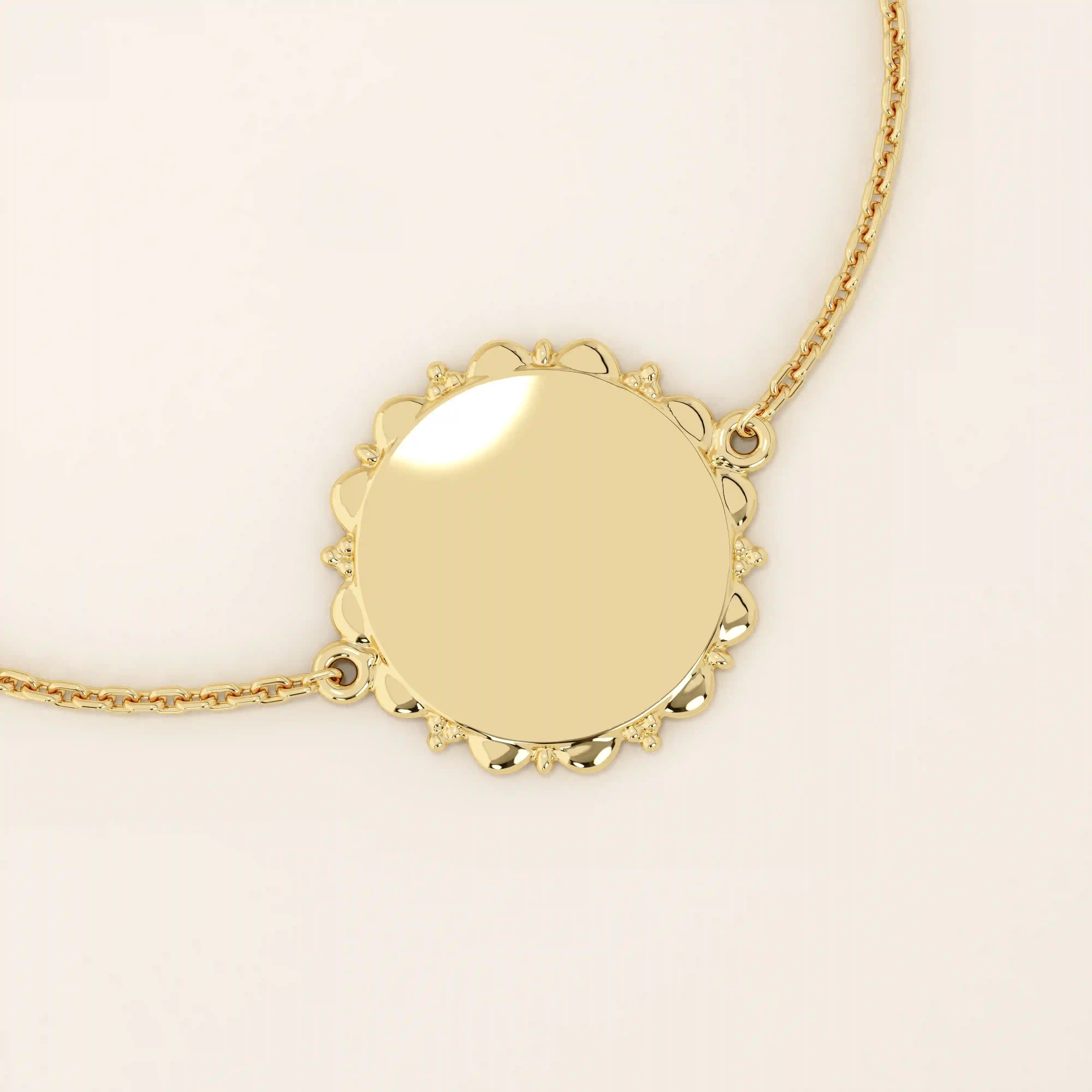 14k solid yellow gold sun bracelet featuring a round medallion with radiant sunburst details and a delicate chain.
