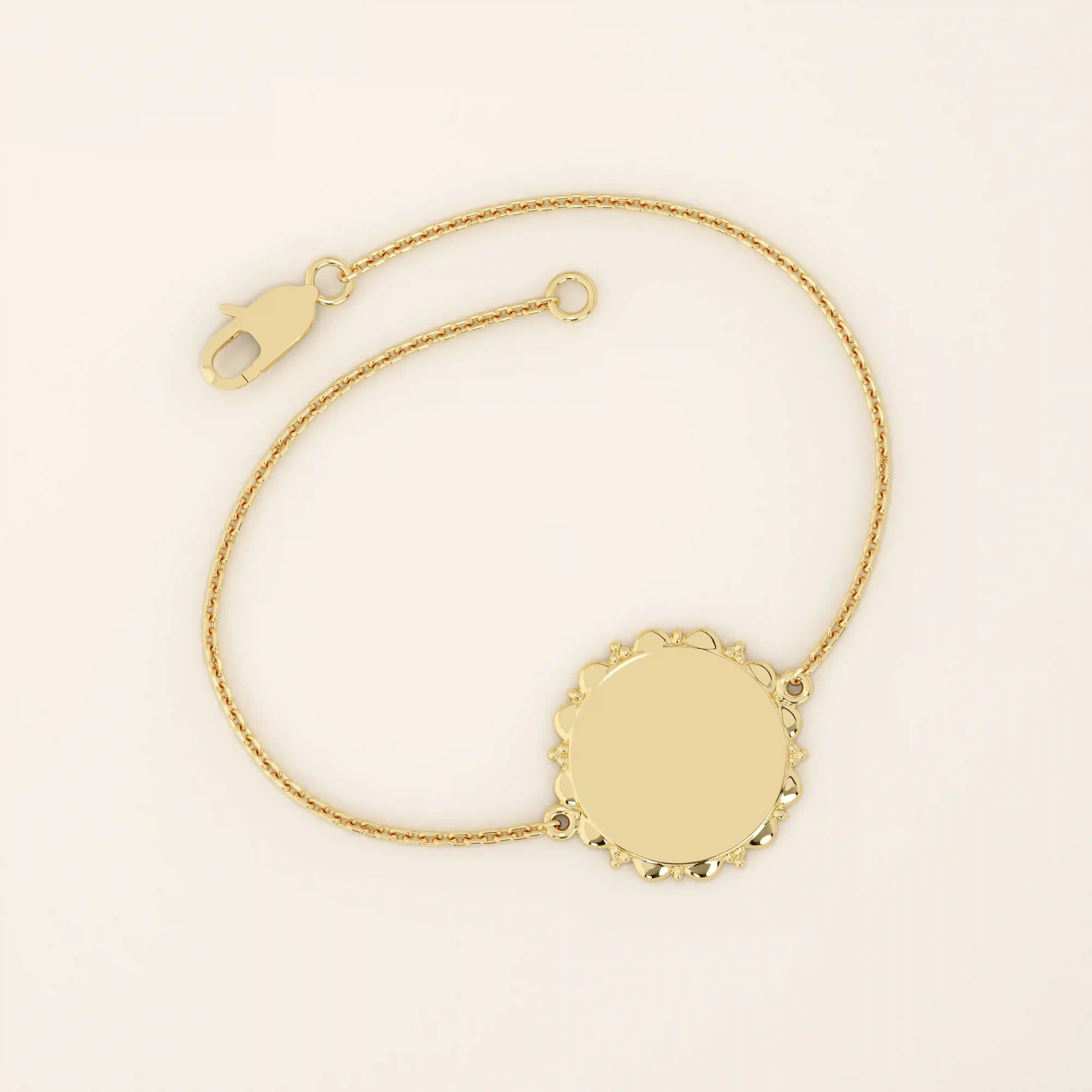 14k solid yellow gold sun bracelet featuring a round medallion with radiant sunburst details and a delicate chain.
