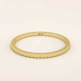 14k solid yellow gold thin stacking ring with a faceted textured design, minimalist fine jewelry for everyday wear or layering
