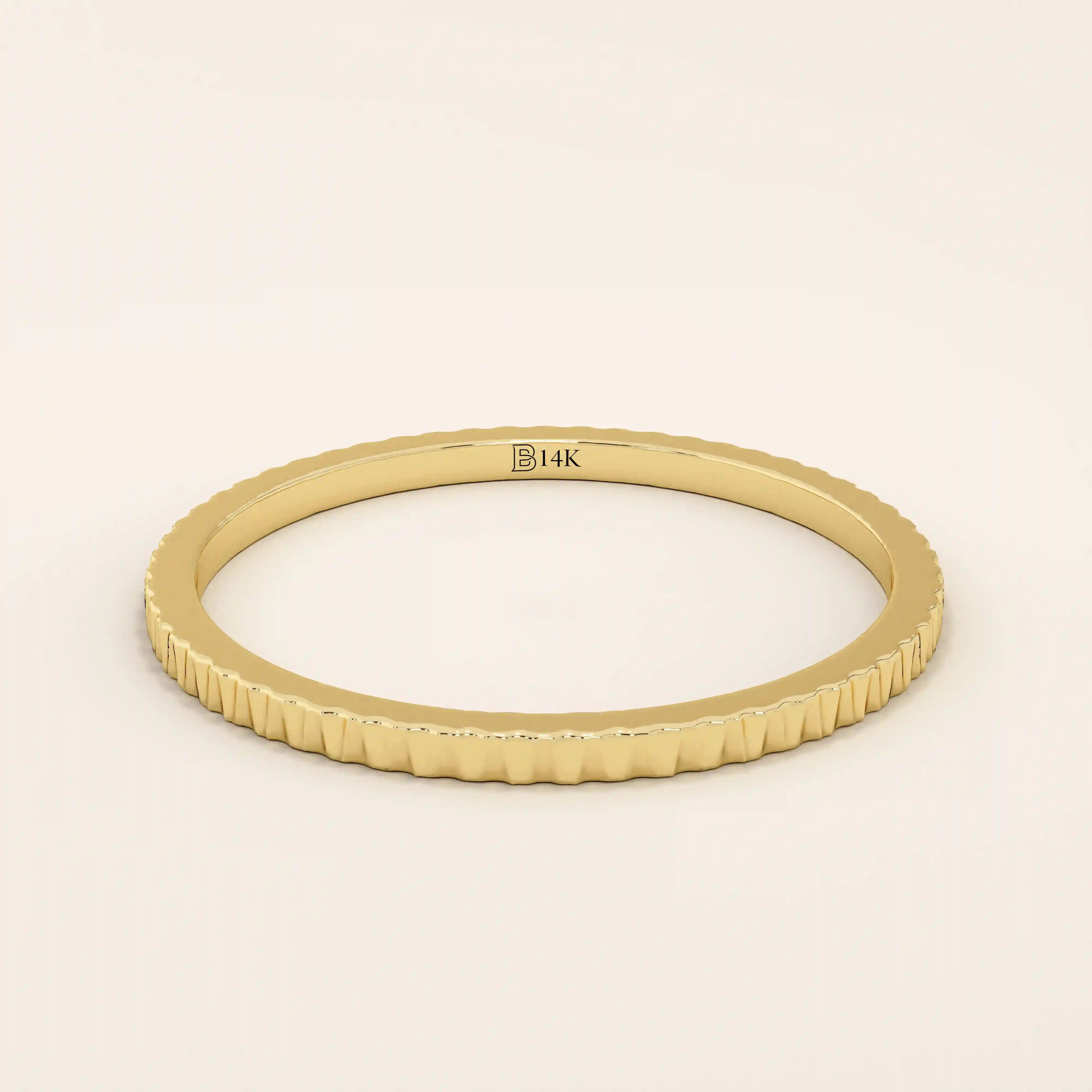 14k solid yellow gold thin stacking ring with a faceted textured design, minimalist fine jewelry for everyday wear or layering
