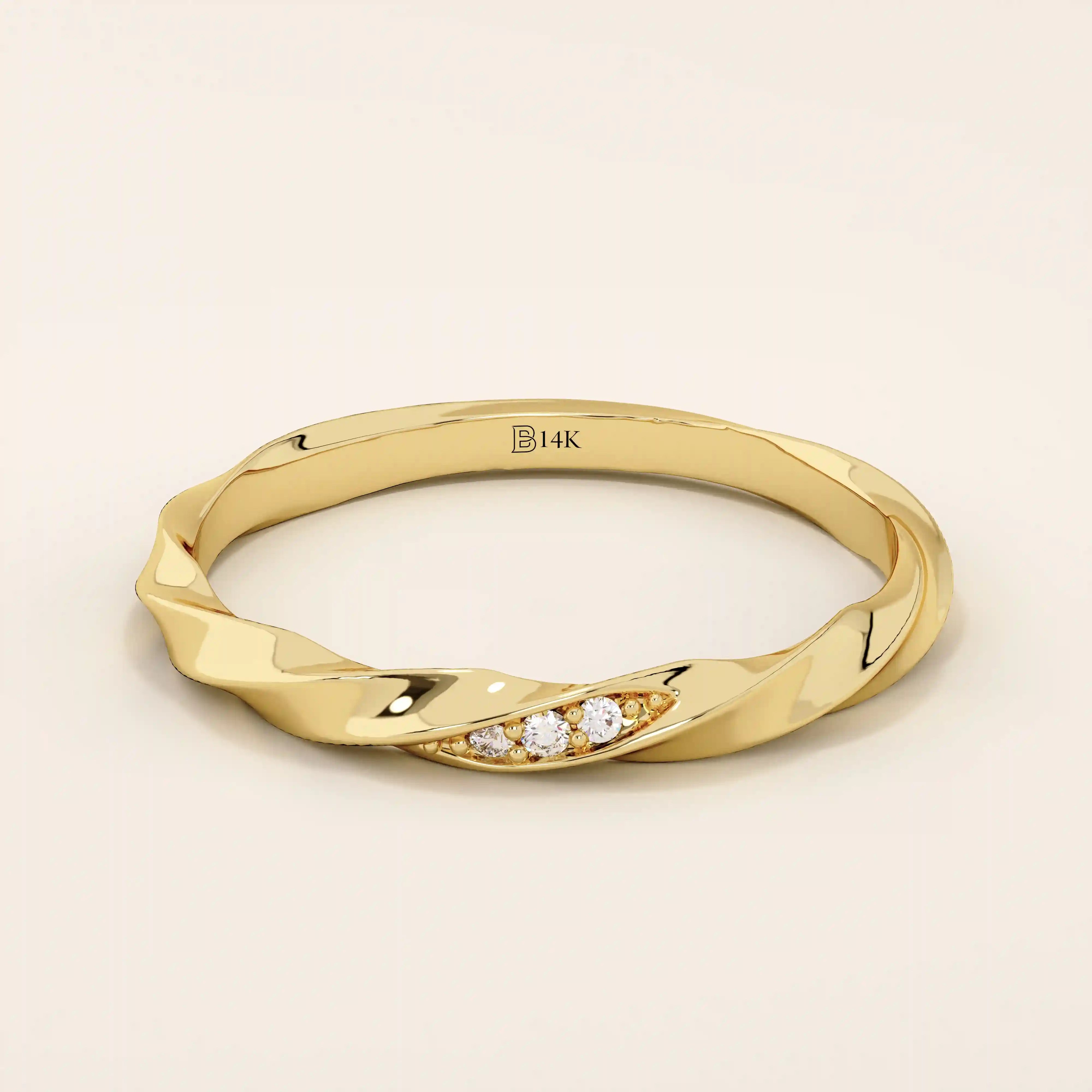 14k solid yellow gold twisted wedding band with a cluster of round brilliant moissanites set in a marquise-shaped opening, modern and elegant design
