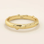 14k solid yellow gold wedding band with a natural woodgrain-inspired texture, organic and nature-themed design
