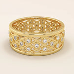 14k solid yellow gold wide wedding band with an open lattice design and bezel-set round moissanite stones in repeating pattern
