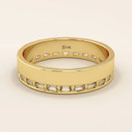 14k solid yellow gold wide wedding band with channel-set baguette-cut moissanite stones in an eternity design

