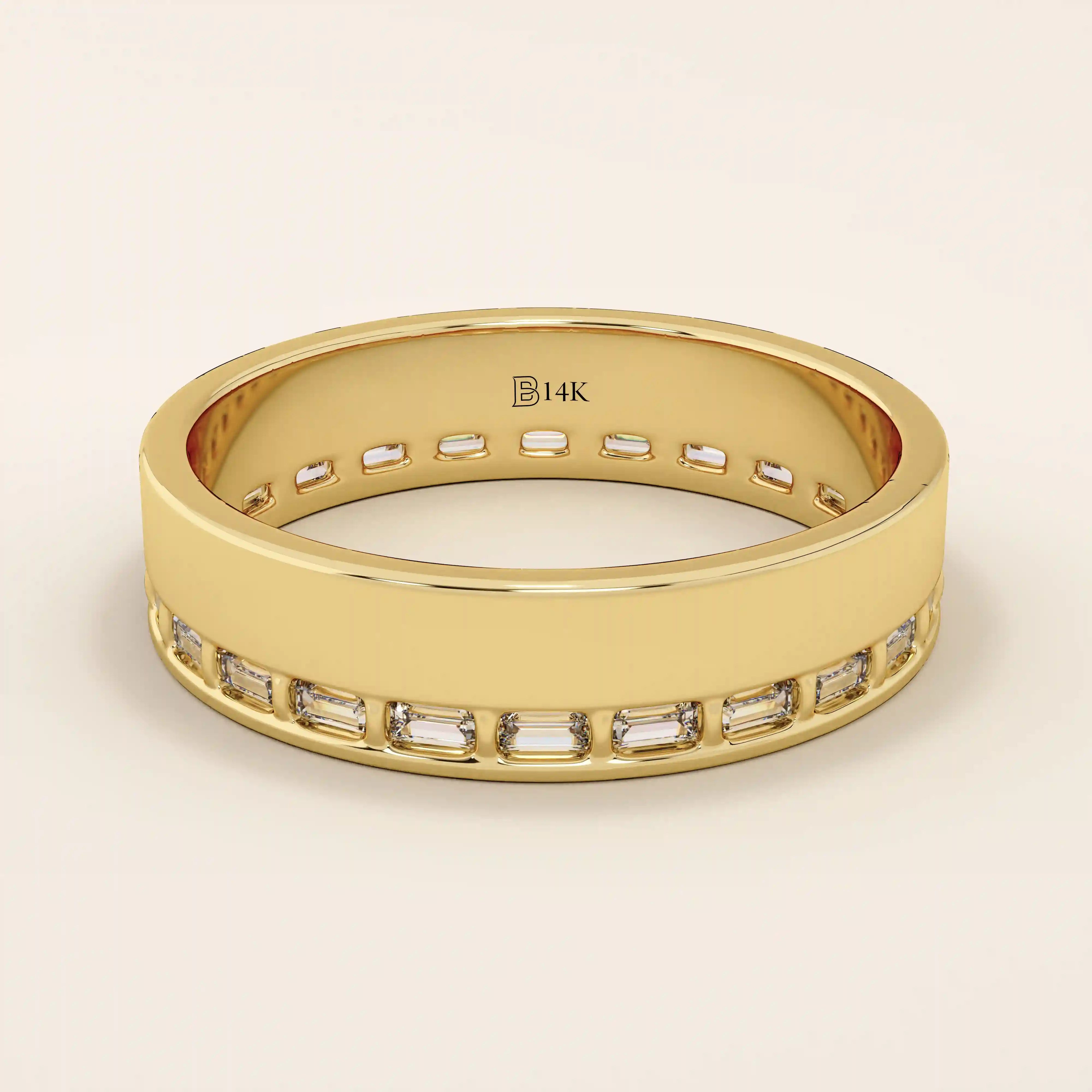 14k solid yellow gold wide wedding band with channel-set baguette-cut moissanite stones in an eternity design
