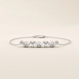 14k white gold baguette bar bracelet with rectangular baguette-cut stones and sparkling round stones in an elegant line design.
