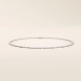14k white gold bracelet featuring a curb link chain design with smooth round disc accents.
