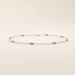 14k white gold bracelet featuring oval chain links with alternating polished yellow gold bar accents.
