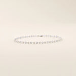 14k white gold bracelet with polished textured discs, each showcasing a radiant starburst effect.
