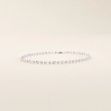 14k white gold bracelet with polished textured discs, each showcasing a radiant starburst effect.
