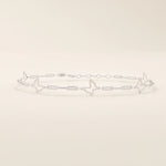14k white gold butterfly bracelet with open butterfly silhouettes connected by polished chain links.
