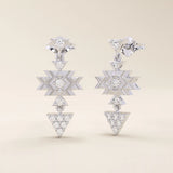 14k white gold geometric motif stud earrings with moissanite accents in star and triangle shapes, dangling design.
