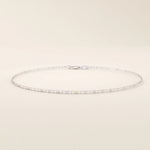 14k white gold scroll chain bracelet with polished rectangular links and delicate scroll cut-out details.
