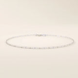 14k white gold scroll chain bracelet with polished rectangular links and delicate scroll cut-out details.
