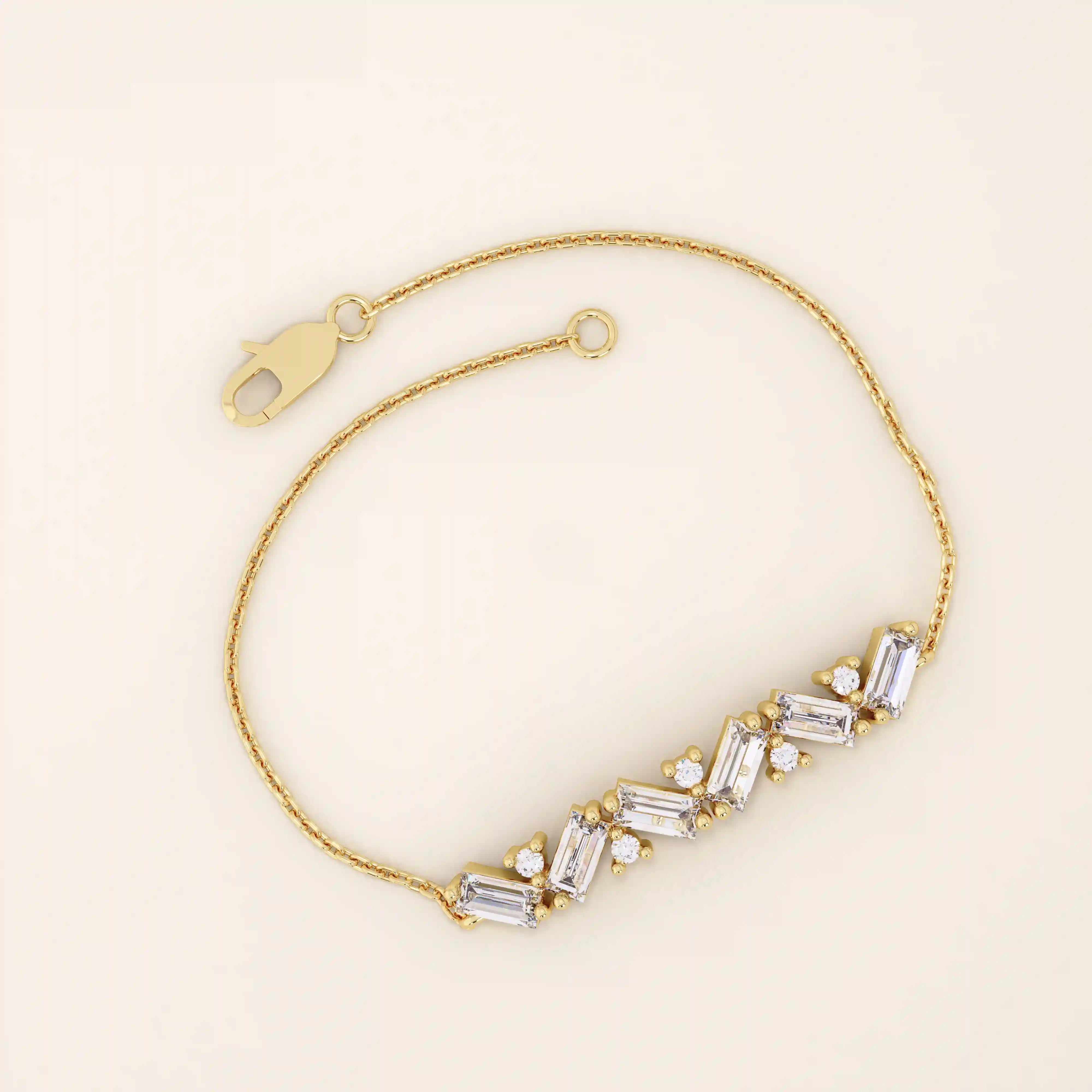 14k yellow gold baguette bar bracelet featuring baguette-cut stones and round brilliant stones set in a sleek chain.
