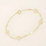 14k yellow gold bracelet featuring dainty flower-shaped charms linked together with delicate chain links.
