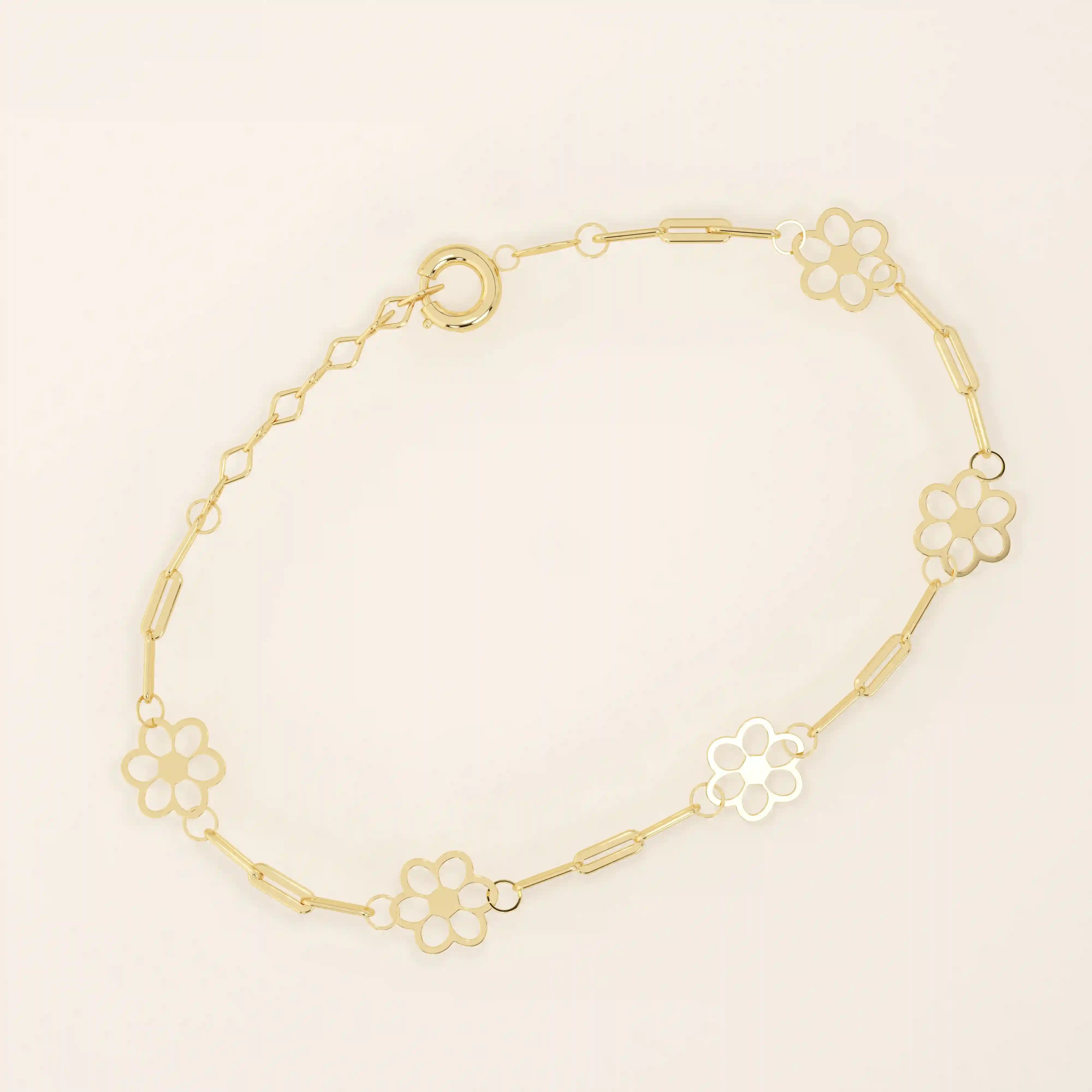 14k yellow gold bracelet featuring dainty flower-shaped charms linked together with delicate chain links.
