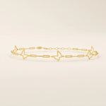 14k yellow gold bracelet featuring open butterfly charms linked with elongated chain links for a delicate look.
